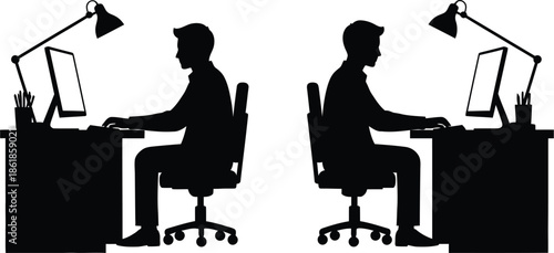 Silhouette of two men sitting in office chairs working intently at separate desks with desktop computers and adjustable lamps