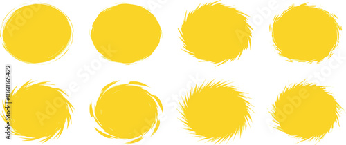 A collection of yellow circles and brush strokes on a white background viewed from a straightforward perspective.