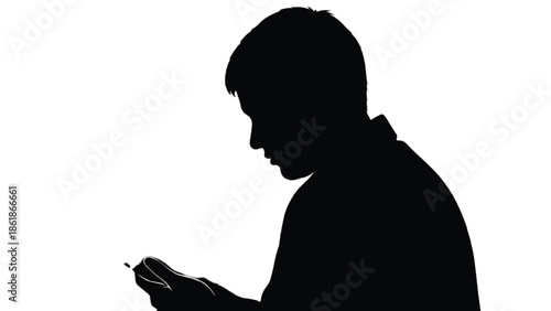 Silhouette of a man looking at a smartphone person