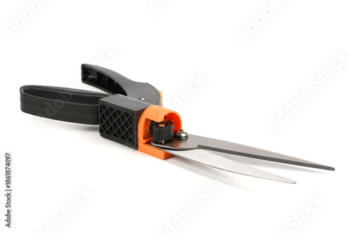 Black and orange garden grass shears isolated on white background