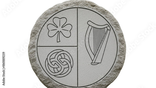Stone with carved Irish symbols shamrock harp and knotwork