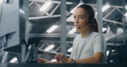 Tableau sur toile Specialist Manages Network Systems From Workstation in Network Operations Center