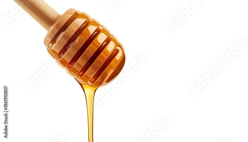 A wooden honey dipper with golden honey dripping from it on a white background
