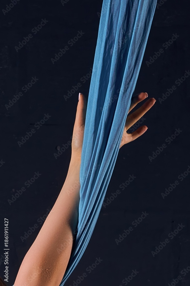 custom made wallpaper toronto digitalGraceful female hand grasping blue aerial silk against a dark background