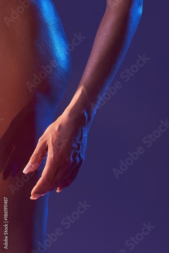 Wallpaper Mural Close-up of a woman's hand and body curve in colorful neon studio light Torontodigital.ca