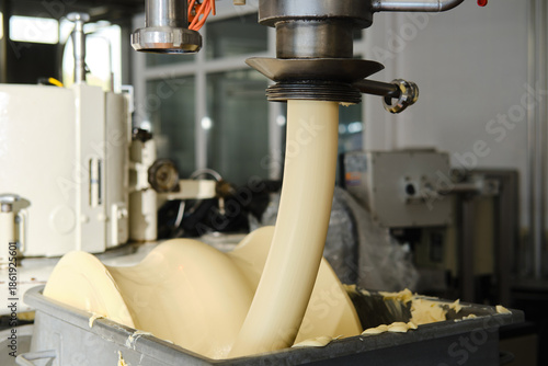 Fotografie Industrial butter processing machine in food factory