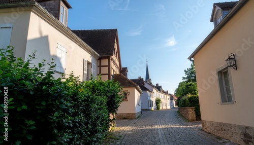 Quaint European Village Street with Historic Buildings.