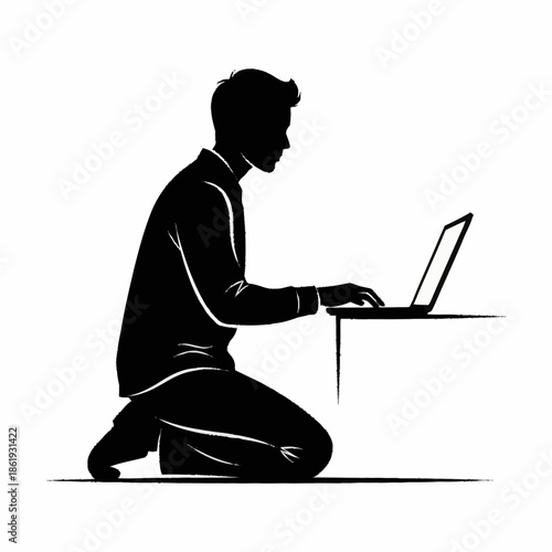 Man Kneeling and Using Laptop Computer.