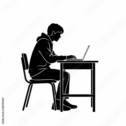 Man Sitting at Desk Using Laptop.