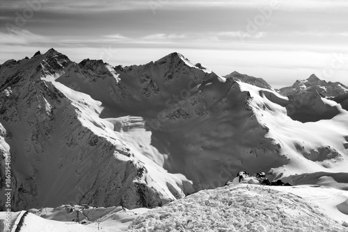 Black and white Snowy off-piste slopes at evening