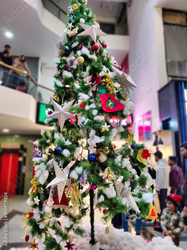 Jaipur, India 24 December 2025: Picture of christmas tree in a shopping mall. Christmas and New Year decoration concept.

