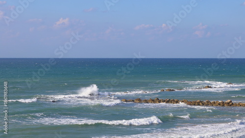 Fototapeta Naklejka Na Ścianę i Meble -  Waves breaking on the rocks in the Mediterranean Sea, Israel.