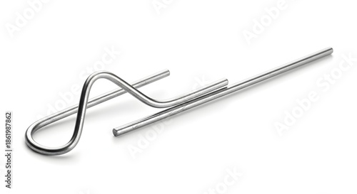 Close up of a silver metal spring clip or wire retainer part featuring intricate bending isolated on a clean white background studio shot