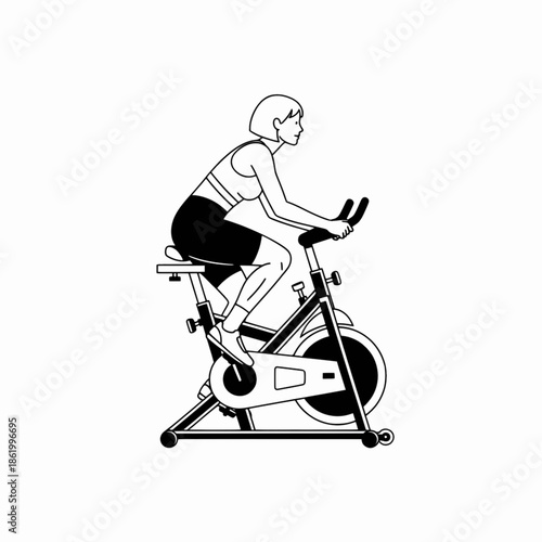 Young woman riding stationary exercise bike for cardio training