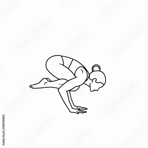 Woman mastering yoga crow pose for balance and focus