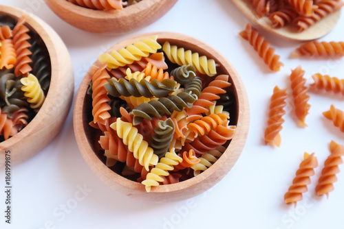 Turkish spiral pasta with tomatoes and spinach was designed in a bamboo bowl