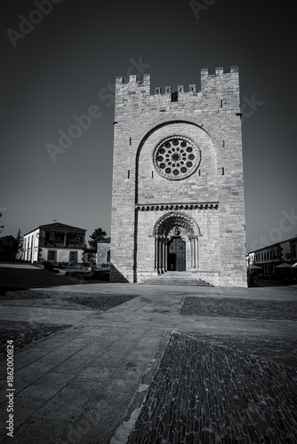 Traditional rural stone house with wooden gallery and slate roof