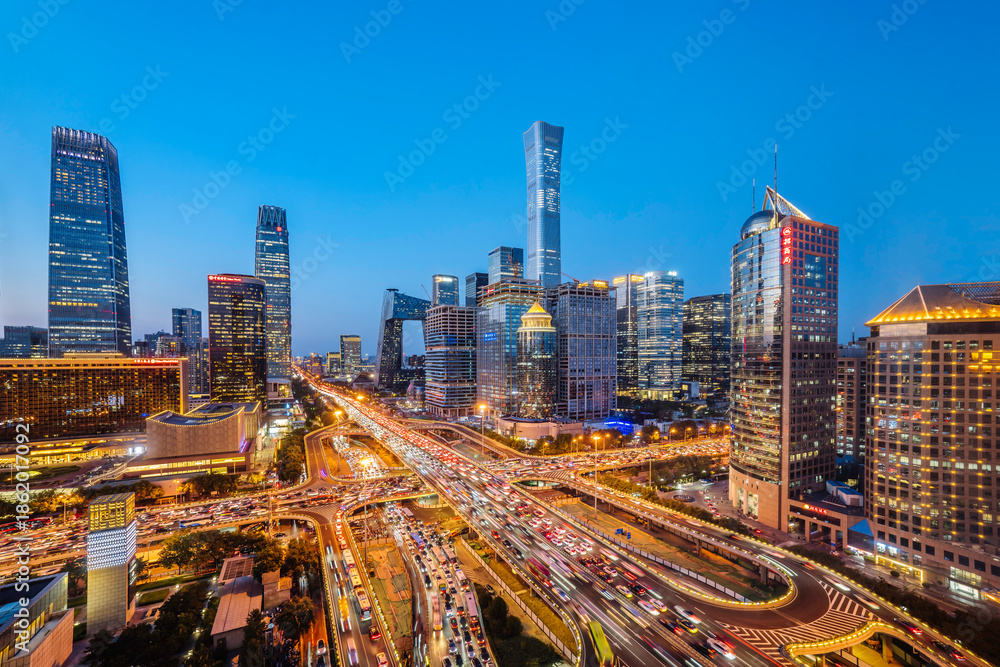 Fototapeta premium High angle night view of the bustling CBD and Guomao Overpass in Beijing, China