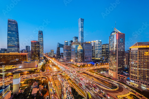 High angle night view of the bustling CBD and Guomao Overpass in Beijing, China