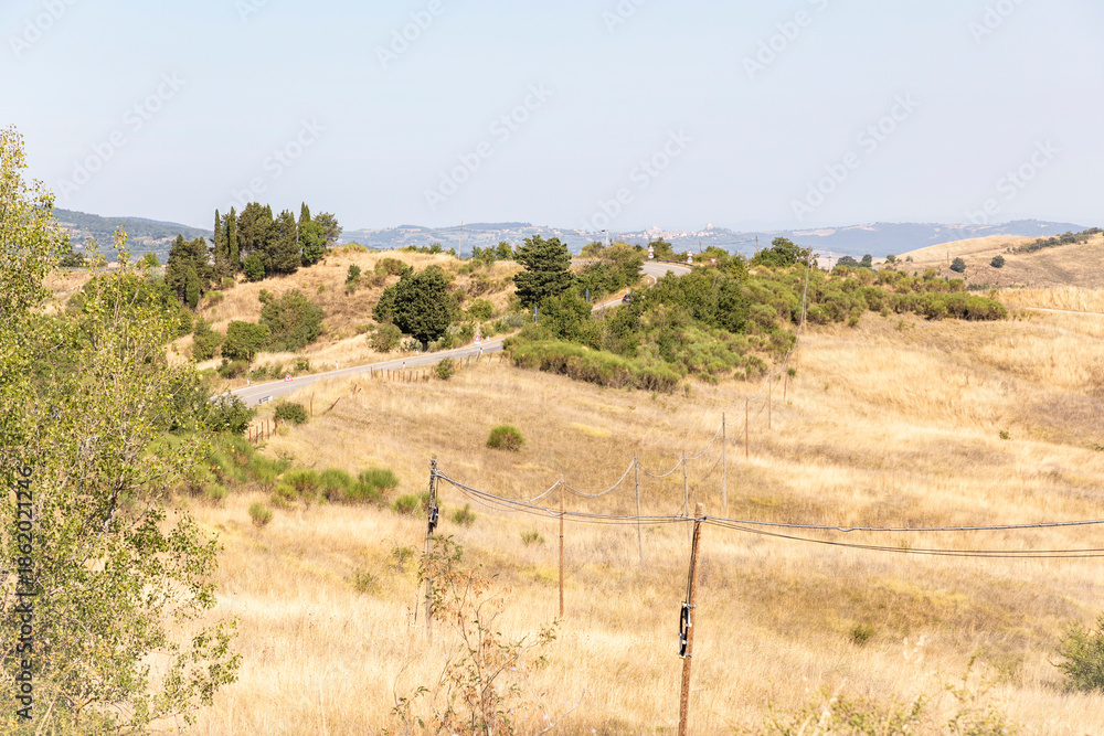 Fototapeta premium Via Francigena - mountain road between Radicofani and Contignano, comune of Radicofani, province of Siena, Tuscany, Italy