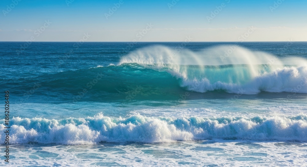 Fototapeta premium A crashing ocean wave, turquoise water, cresting and breaking, with sea foam and blue sky