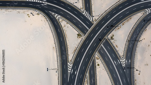 Aerial view of a complex highway interchange with multiple curving roads and intersections.