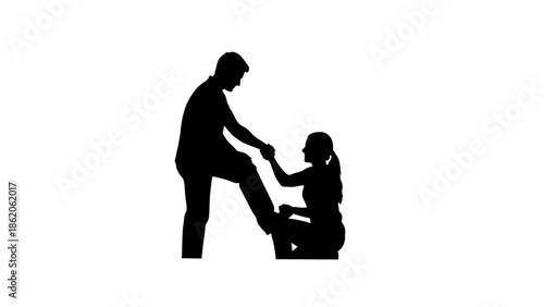 Silhouette of a man helping a woman to stand up.