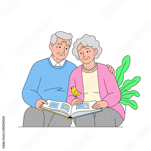 Senior couple looking at photo album together with plants in background  