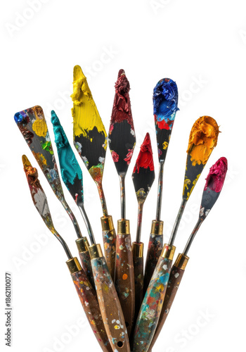eleven professional palette knives caked with textured oil paint (crimson, yellow, teal) and worn wood handles, standing against a seamless transparent studio background, visual study of artistic