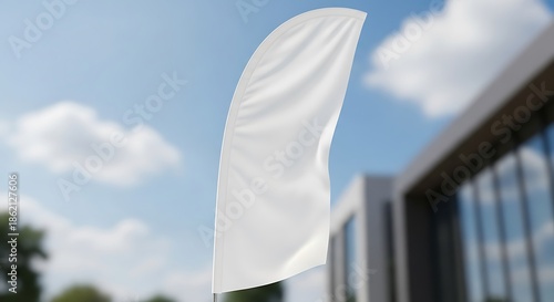 Blank White Feather Flag Against Blue Sky and Building.