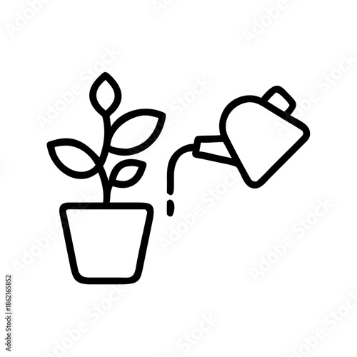 Plant care with watering can pouring water into potted plant  