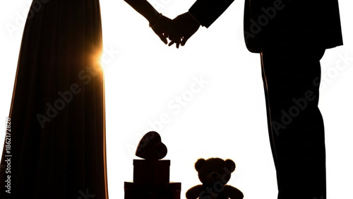 Couple holding hands with wedding cake in the background