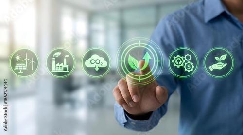 ESG and net zero carbon emission concept with hand touching green nature icons on virtual screen,sustainable energy strategy for environmental care,eco friendly industry,climate goal.