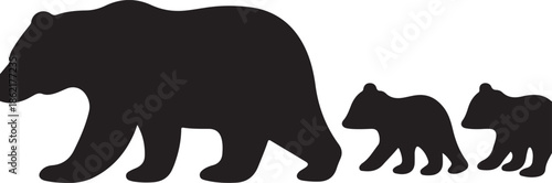 Silhouette of a mother bear with two cubs walking in a line