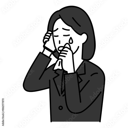 スマホでの会話で泣く喪服の女性