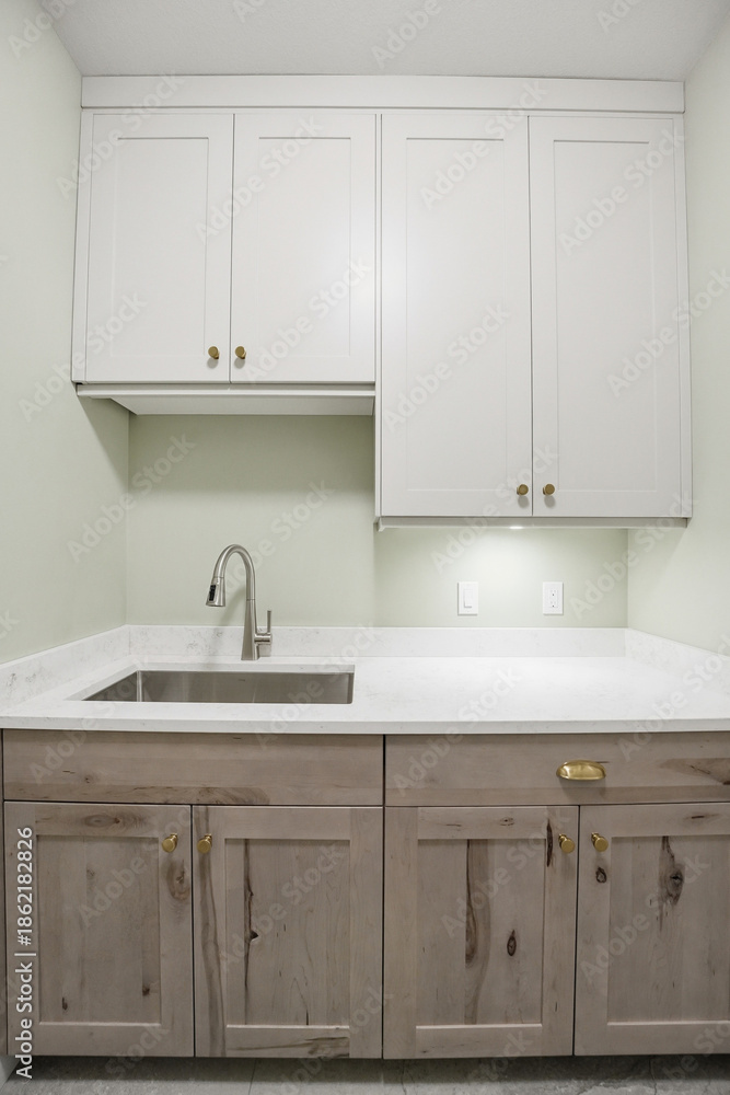 Fotografie White kitchen with a sink and cabinets