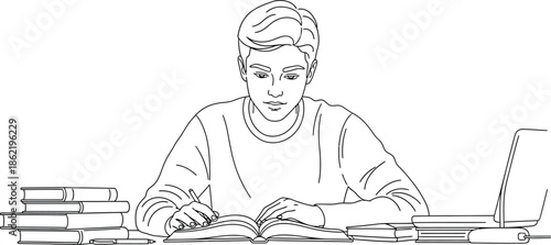 Focused young male student diligently studying an open book with a pen in hand surrounded by stacked textbooks and a modern laptop illustrating dedicated learning
