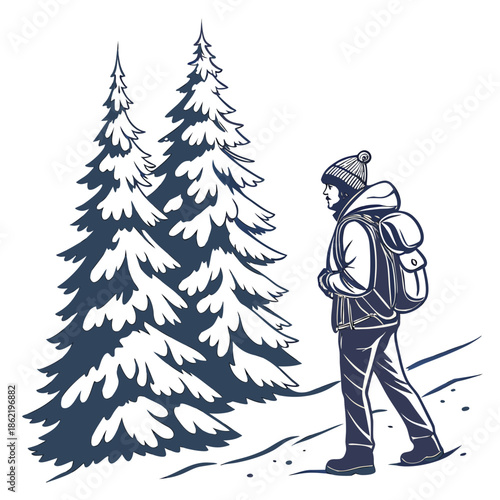 Backpacker standing beside snowy pine trees in winter clothing