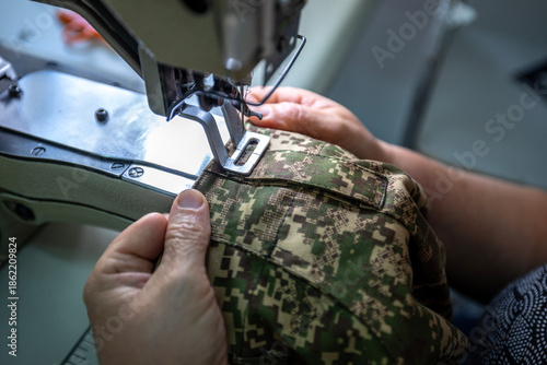 Industrial sewing machine making military uniform parts