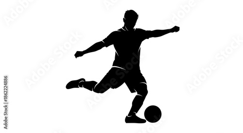 Silhouette of soccer player kicking ball in dynamic action pose