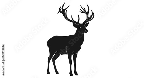 Majestic stag with impressive antlers in strong black silhouette