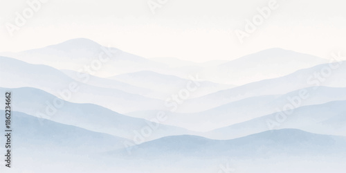 A breathtaking misty mountain landscape at sunrise featuring snow-covered peaks and a dense forest valley under a vibrant blue sky filled with soft white clouds