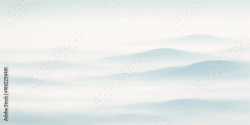 A serene summer landscape view of white clouds in the blue sky over a mountain horizon and calm sea water captures the bright natural light of a cloudy day