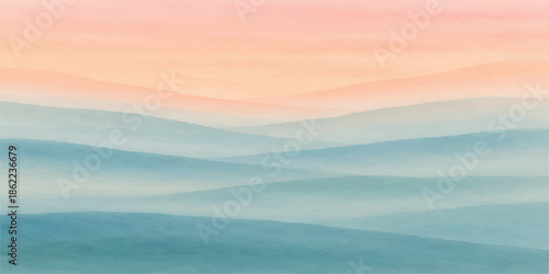 A breathtaking nature landscape view of sunlit clouds and mountains at sunrise, where the morning mist settles over the blue valley and snow-capped peaks under a golden horizon at dawn