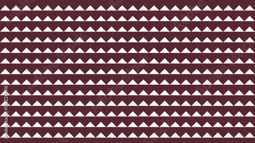 Maroon and white geometric pattern featuring a series of triangles arranged in a repeating design.