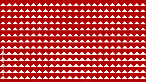 A geometric pattern featuring red and white triangles arranged in a repeating design