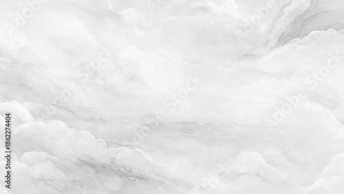 An abstract grayscale image showcasing a swirling pattern reminiscent of clouds and soft flowing smoke