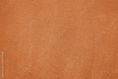 Bild auf Leinwand peach fuzz pink brown cement in plaster concrete wall texture background, cement wall backdrop