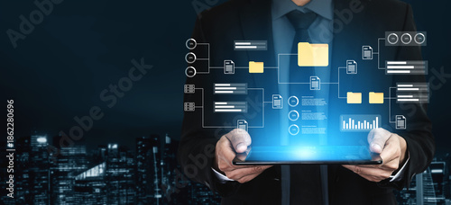 фотографія A business professional holds a tablet showcasing a digital interface filled with data and analytics, set against a modern city skyline at night, symbolizing innovation