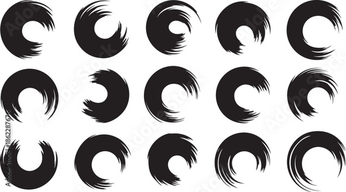 Various circular black brush strokes with a rough textured edge create interesting shapes on white